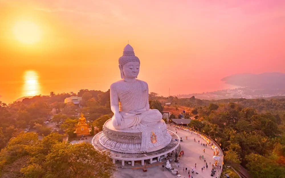 Aerial view of the Big Buddha statue in Phuket, Thailand at sunset , venue destination for the 20th anniversary Global Wellness Summit, November 10-13, 2026