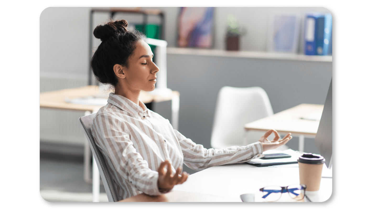 A Woman Practicing Mindfulness Exercises at Work through Beginner Friendly Mindfulness Meditation