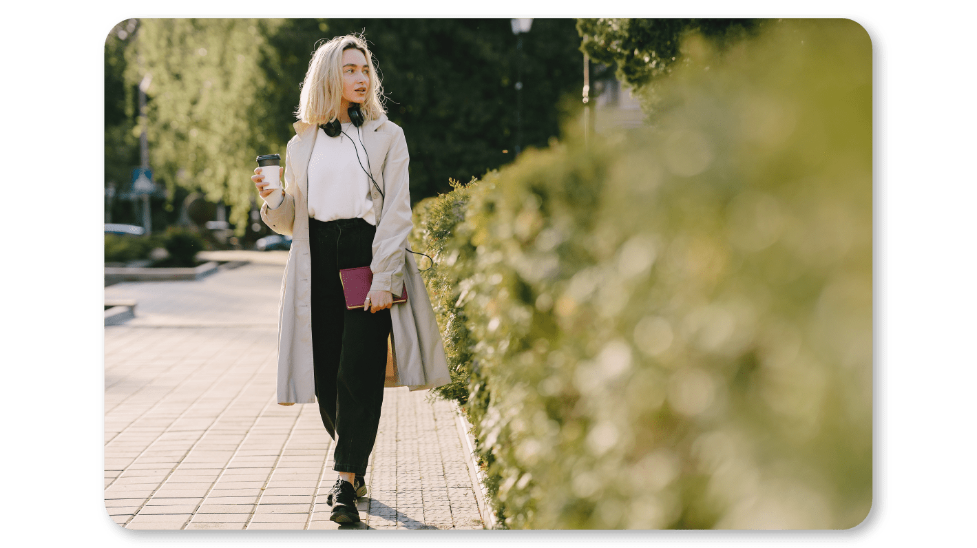 A Woman Practicing Mindfulness Exercises at Work by taking a Stroll outside to Unplug herself