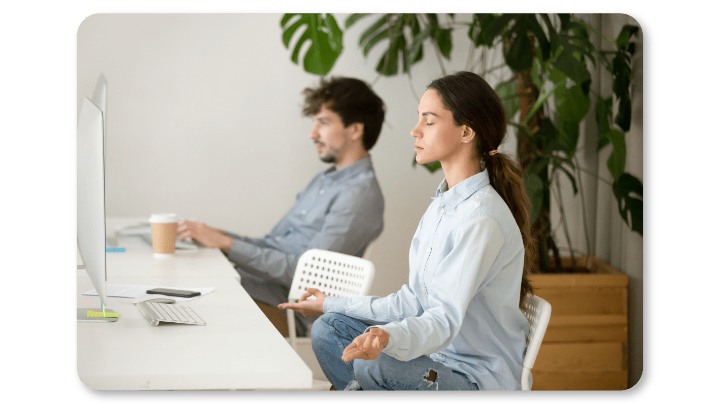 A Woman Practicing Mindfulness Exercises at Work through Mindful Body Scan