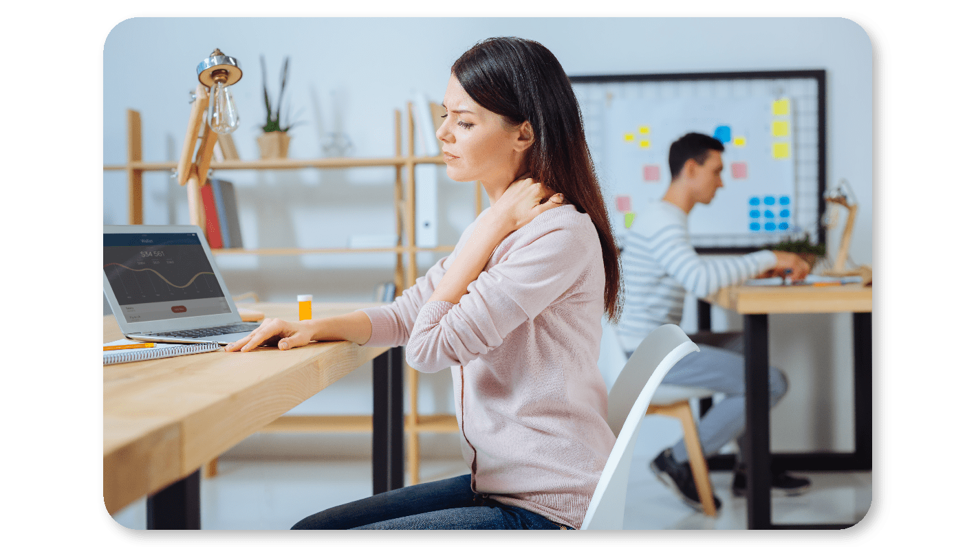 Employee experiencing neck pain after working in a poor posture