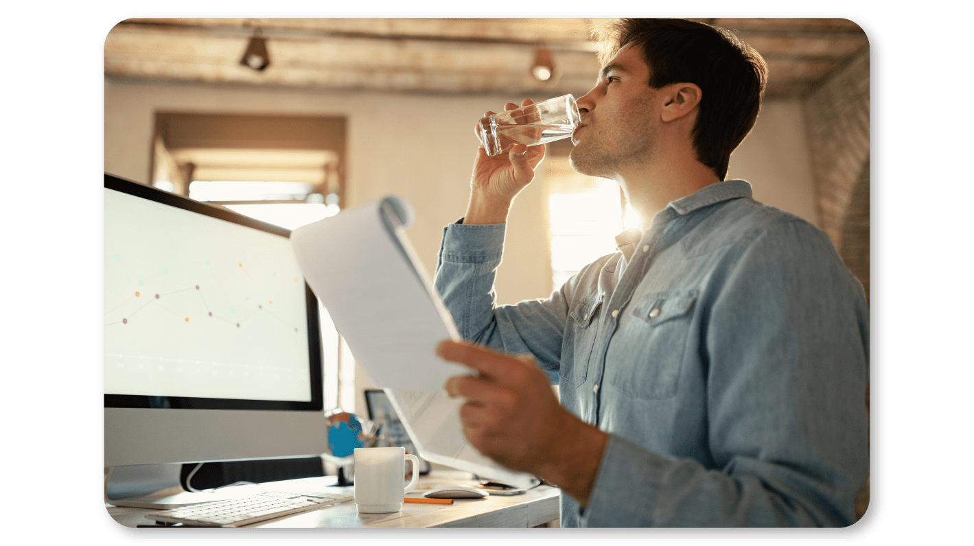 An Employee Practices Self Care At Work by Staying Hydrated