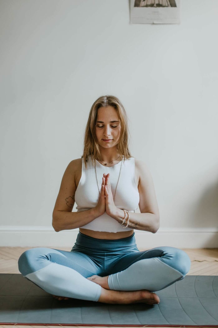 Employee in a seated yoga and meditation pose