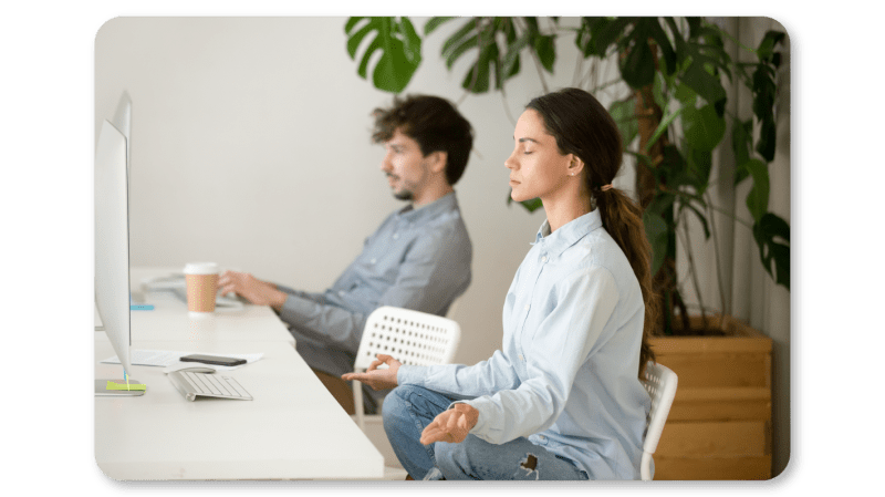 A Woman Practicing Mindfulness Exercises at Work through Mindful Body Scan