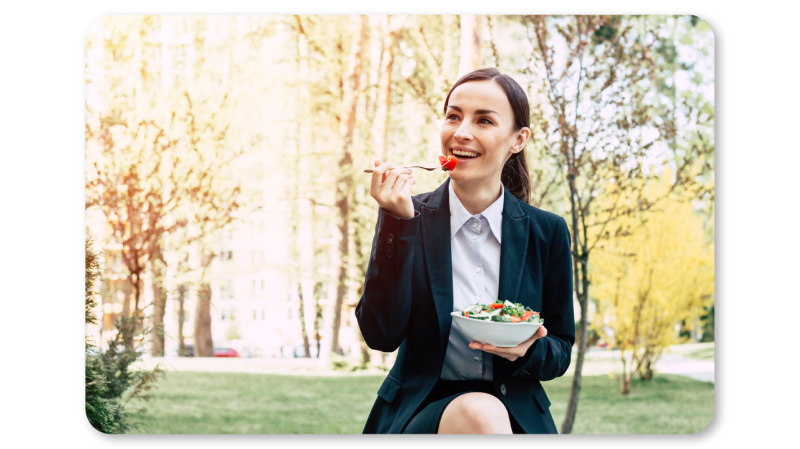 A Woman Practicing Mindfulness Exercises at Work through Mindful Eating