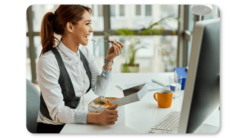 An Employee Practices Self Care At Work by Eating a Balanced Diet