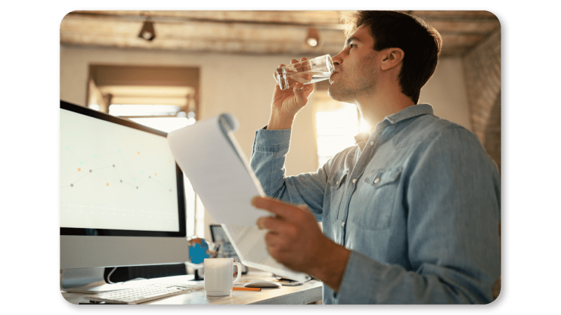 An Employee Practices Self Care At Work by Staying Hydrated