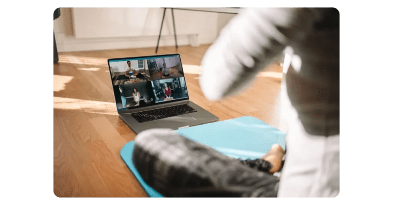 employee attending online yoga class.webp