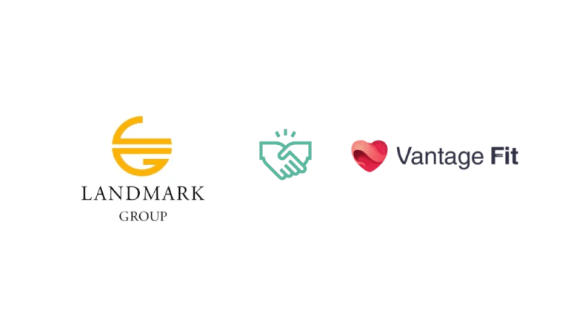 The logos of Landmark Group, Vantage Fit, and a handshake, representing a partnership in the context of wellness programs.